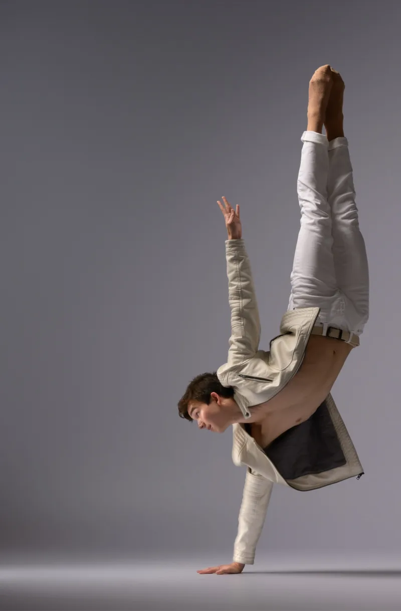 Full-body studio portrait of Karl Pil in motion
